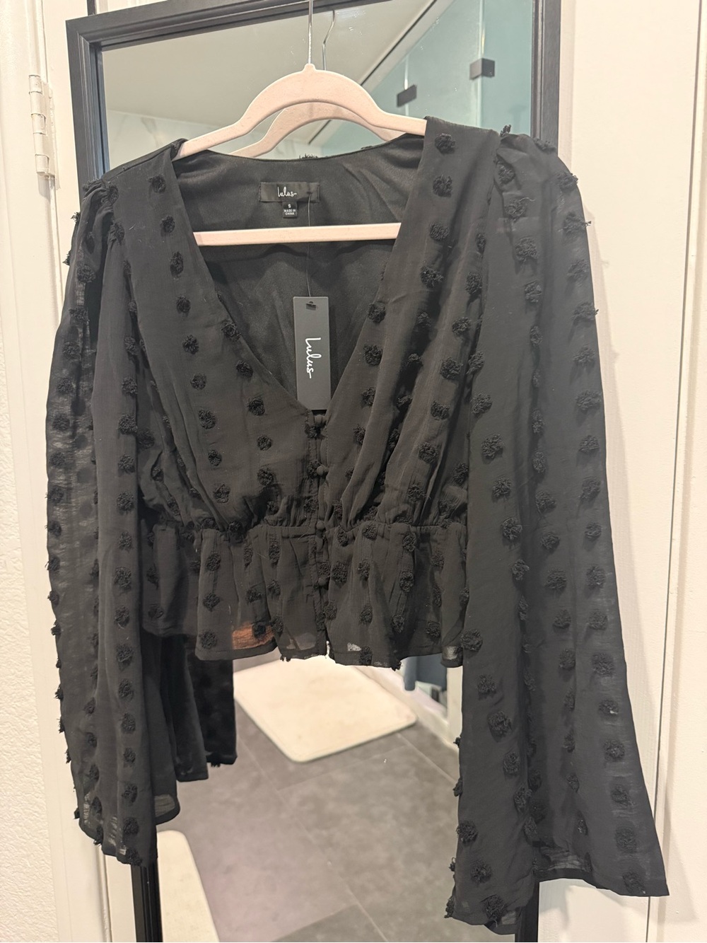Lulu's Black Swiss Dot Peplum V-Neck Blouse